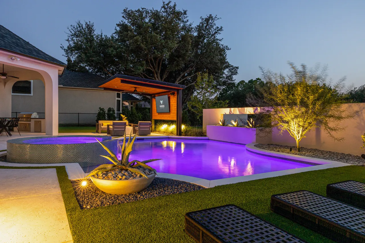 Resort-style pool and outdoor living environment at twilight